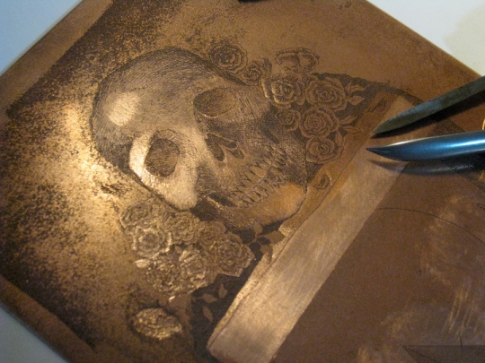 scraping and burnishing a copper etching plate